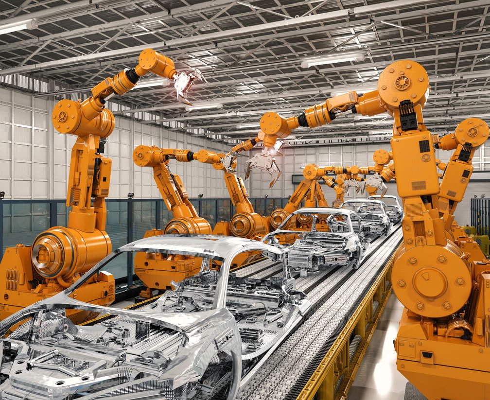Robots industriels orange sur une ligne d’assemblage automobile